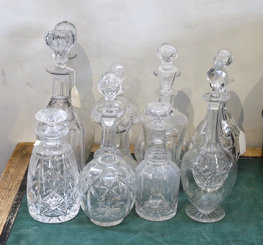 Twelve Victorian and later glass decanters and stoppers, tallest 35cm